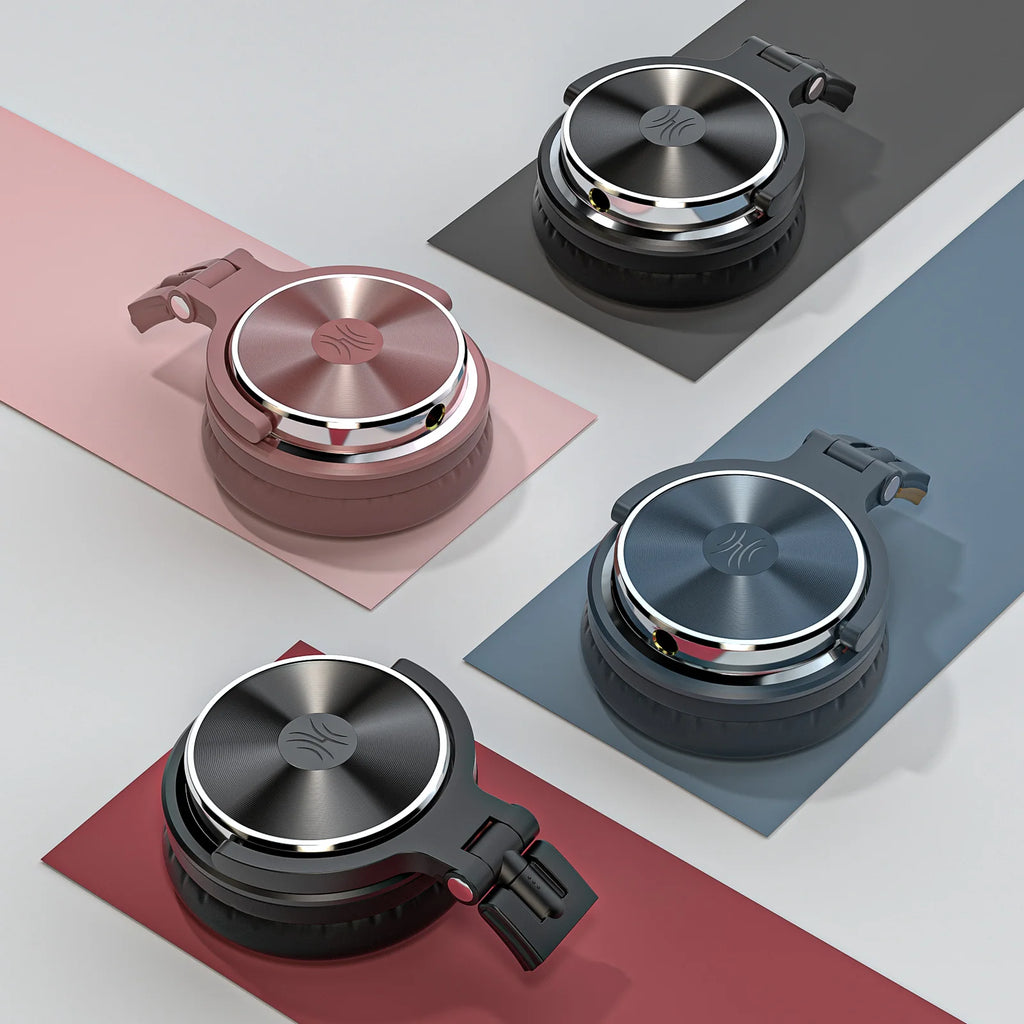 Four foldable over-ear studio headphones in black, grey, blue, and rose gold with metallic circular earcups.