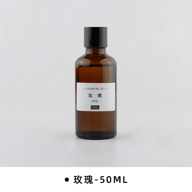 50ml rose essential oil in an amber glass bottle with a black screw cap and simple minimalist white label.