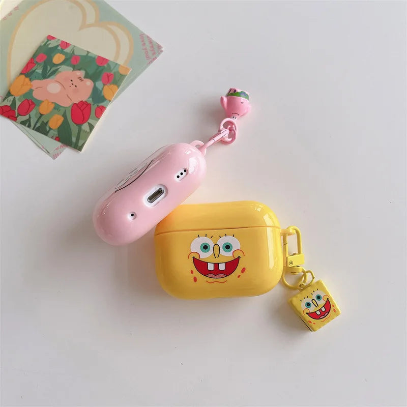 Yellow silicone SpongeBob AirPods Pro case with matching character charm and a separate pink case with charm.