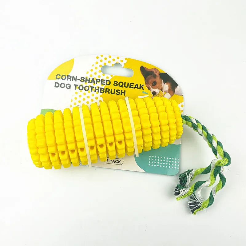 Yellow corn-shaped TPR dog chew toy with a green and white braided cotton rope handle.