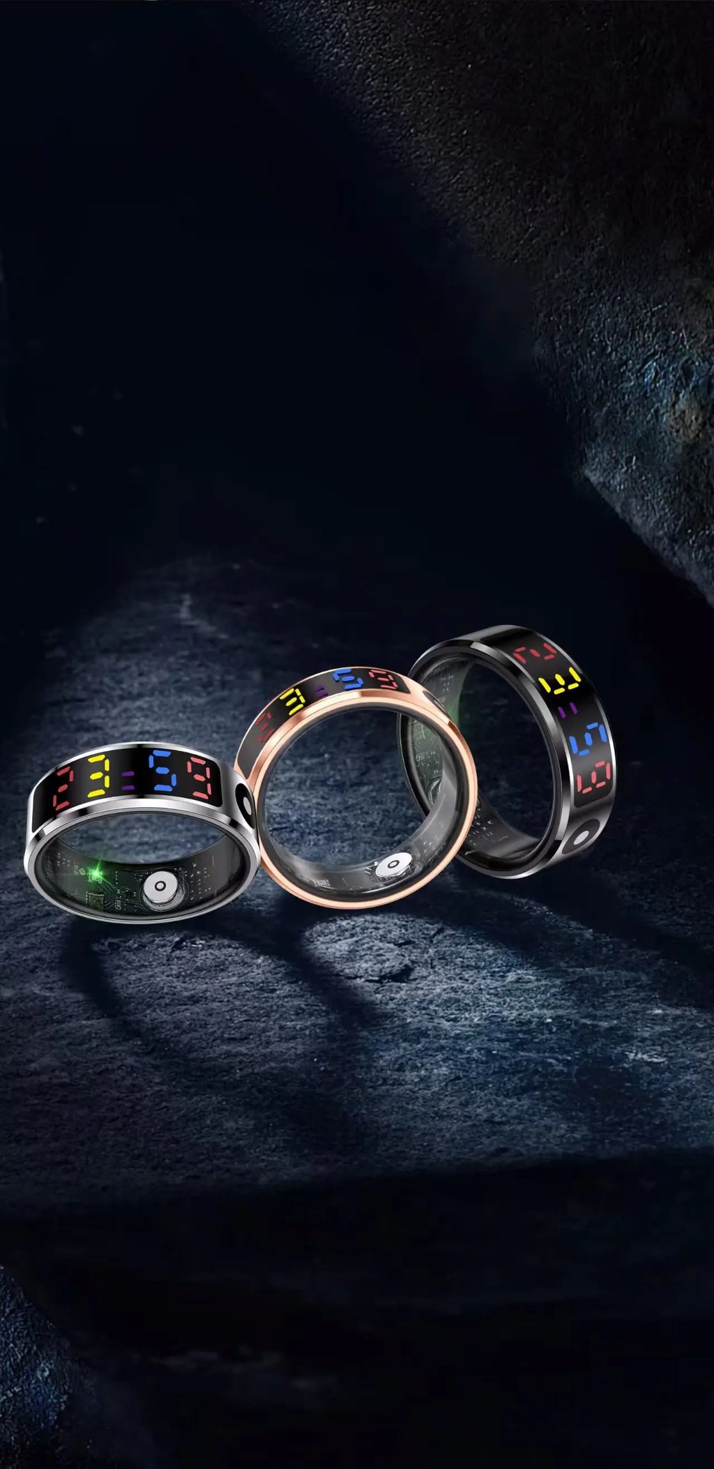 Three smart rings in silver, rose gold, and black with digital time displays and health monitoring sensors.