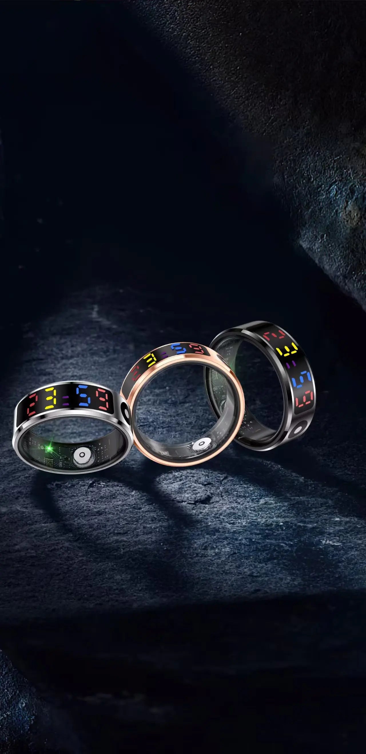 Three smart rings in silver, rose gold, and black with digital time displays and health monitoring sensors.