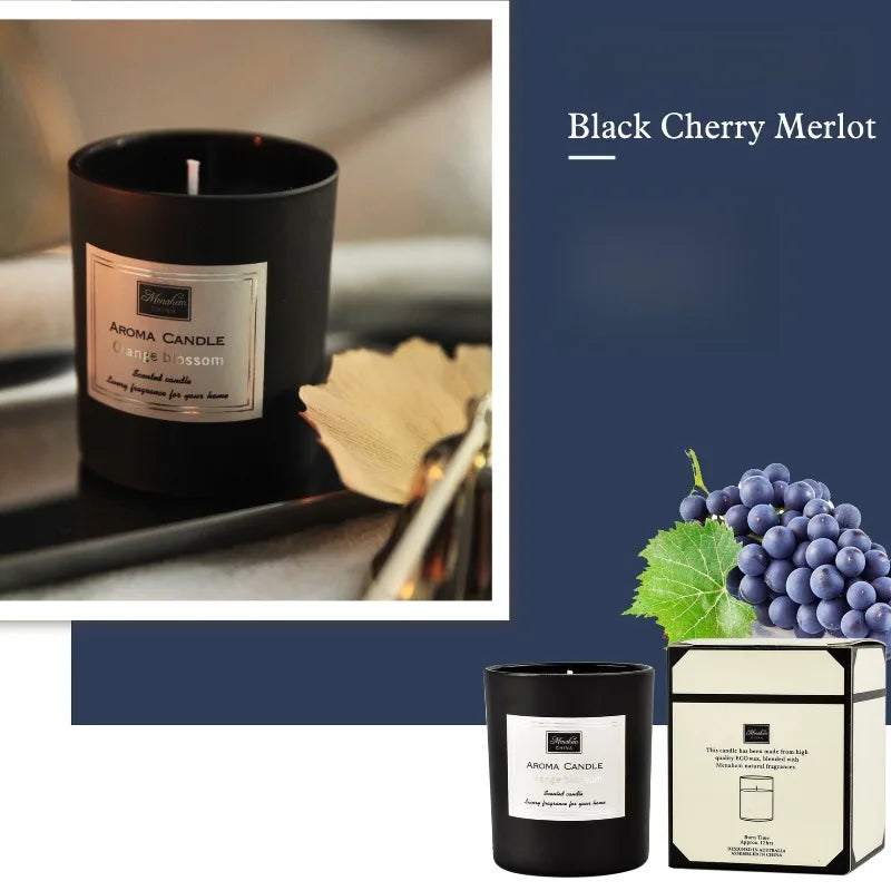 Black cherry merlot scented candle in a sleek black glass jar with a white label and matching presentation box.