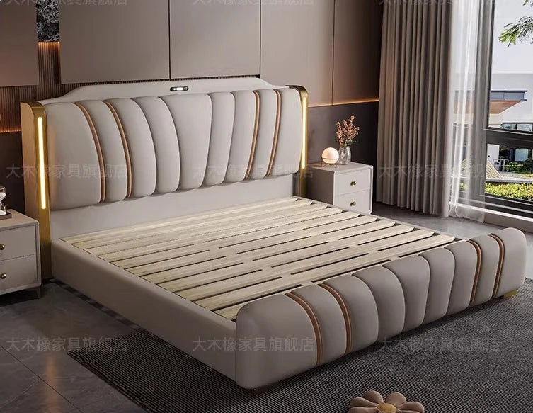 Luxury cream upholstered bed with vertical channel tufting, gold accents, and integrated LED headboard lighting.