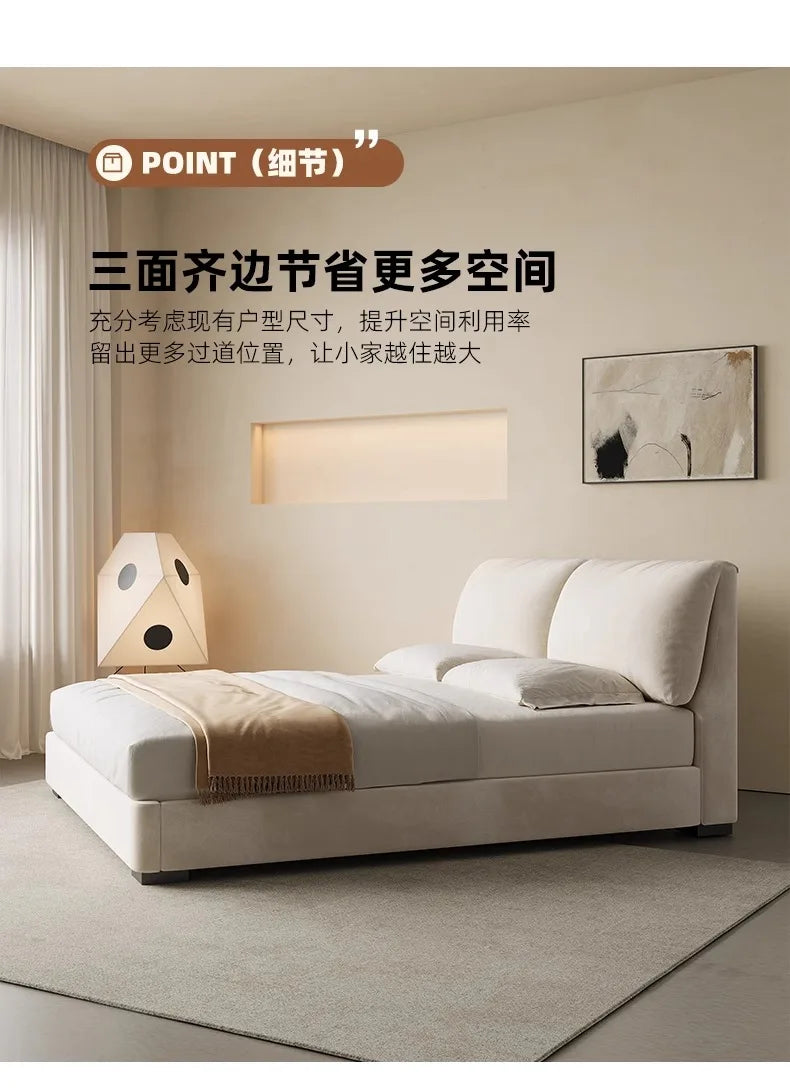 Modern cream-coloured 180x200cm storage bed featuring a plush, padded headboard in a minimalist bedroom setting.