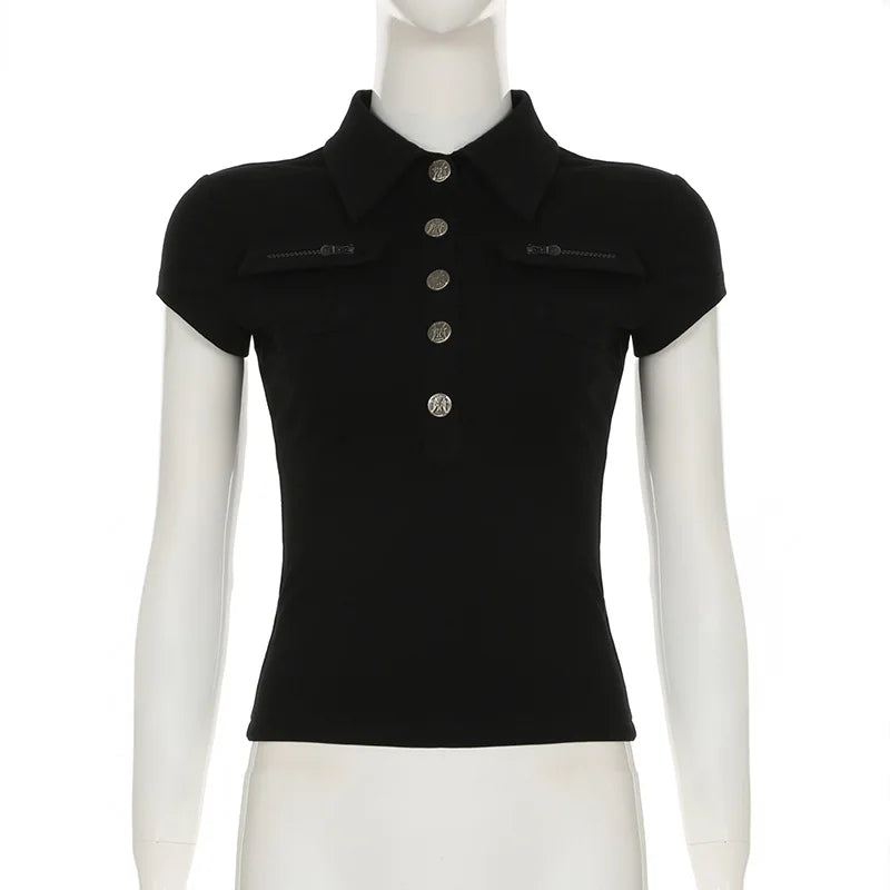 Black short-sleeved polo shirt with a collared neckline, silver button-down front, and two flap chest pockets.