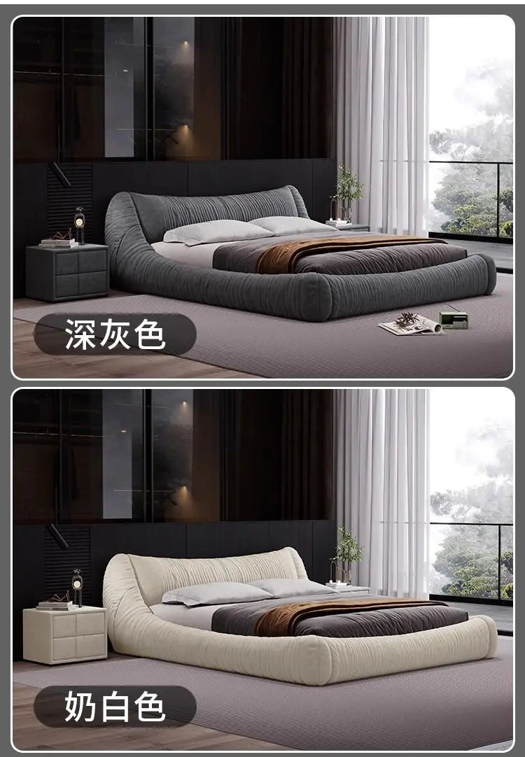 Modern low-profile bed frames in dark grey and cream, featuring a curved, tufted upholstered design.