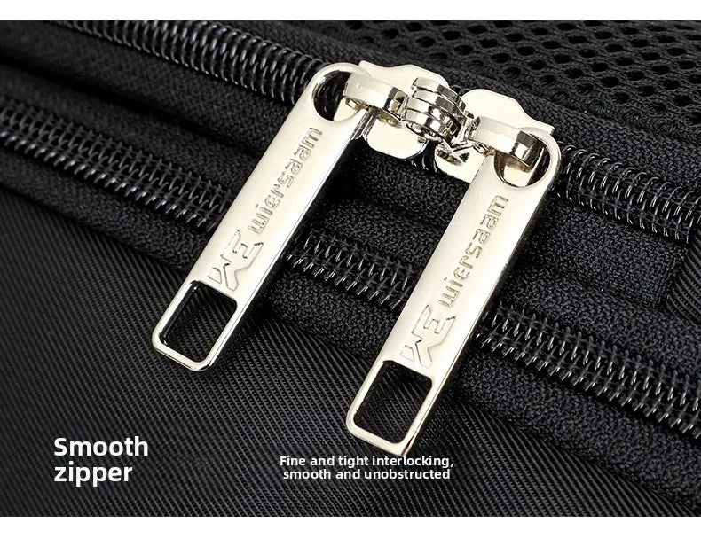 Close-up of a black travel bag with smooth, high-quality silver metallic double zips.