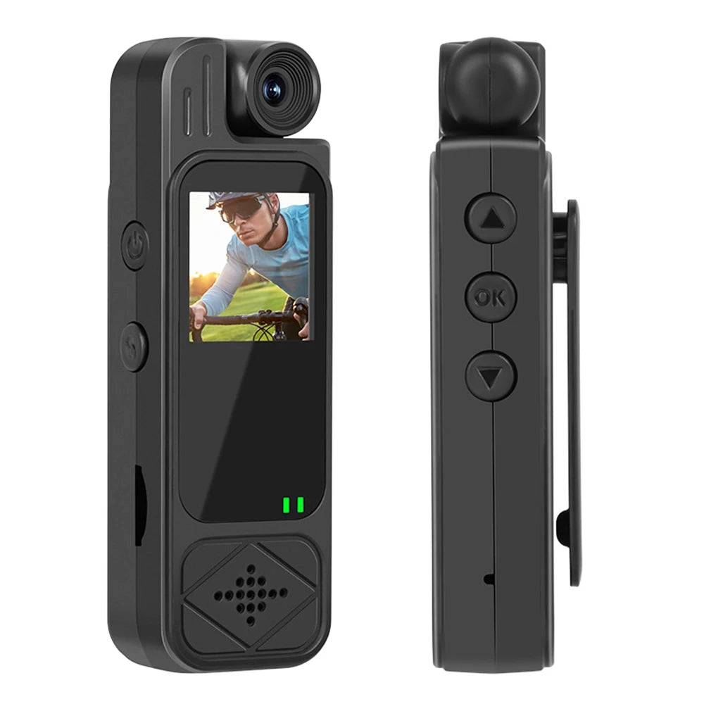 Black plastic portable body camera with a screen, rotatable lens, control buttons, and a belt clip.