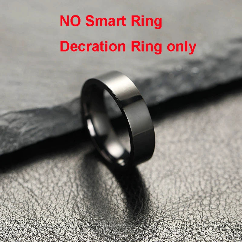 A sleek, polished black metal ring resting on a textured dark surface. Decorative, non-smart fashion jewellery.