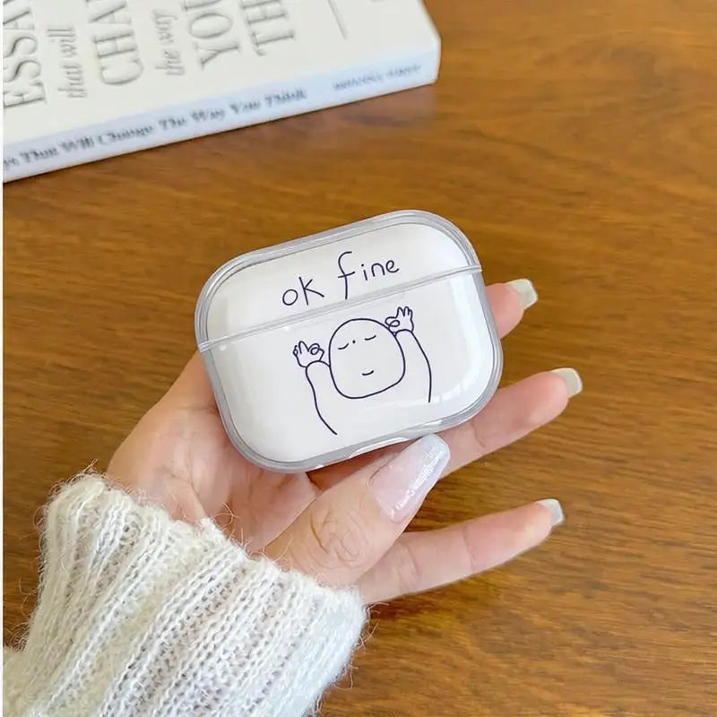 Clear AirPods Pro case with 'ok fine' text and doodle, held in hand.