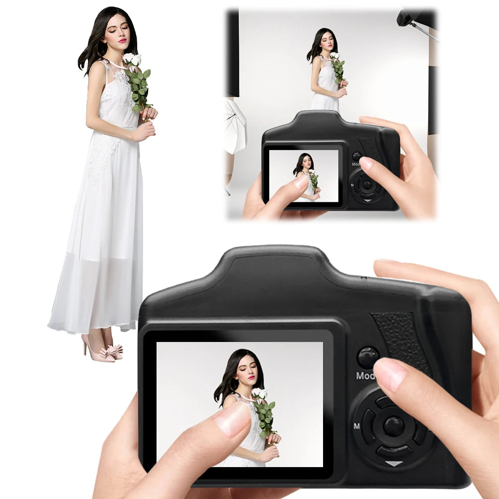 Black digital camera with a screen displaying a photo of a woman in a white dress held by hands.