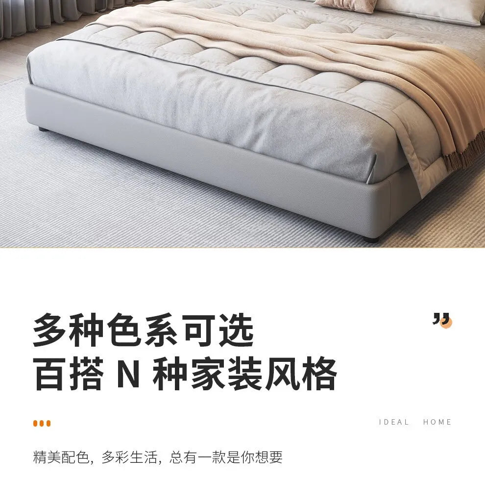 A minimalist grey, low-profile upholstered queen bed frame with a sleek, modern aesthetic.