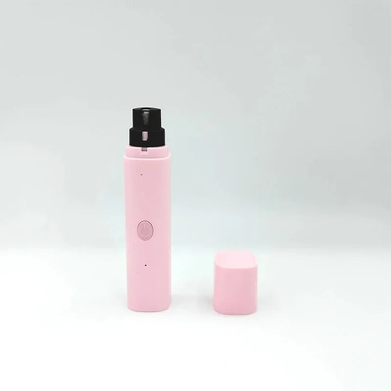 Pastel pink electric pet nail grinder with a black grinding head and matching detachable cap on a white background.
