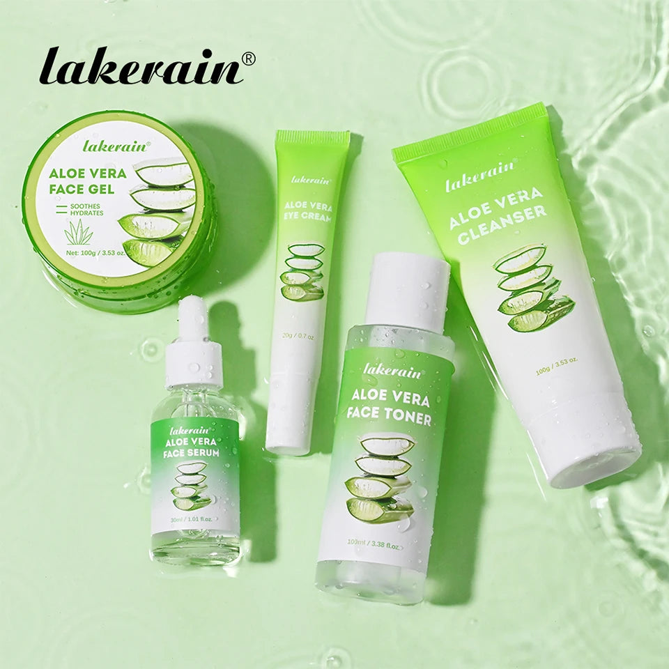 Aloe vera skincare set including face gel, eye cream, cleanser, serum, and toner in green packaging on water surface.