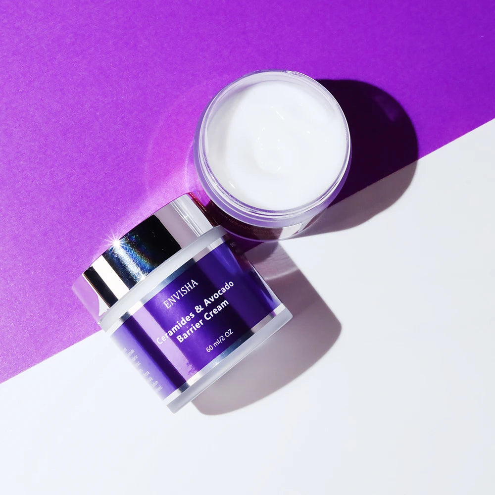 A 60ml jar of ceramides and avocado barrier cream with a shiny lid, shown open and closed on a purple background.