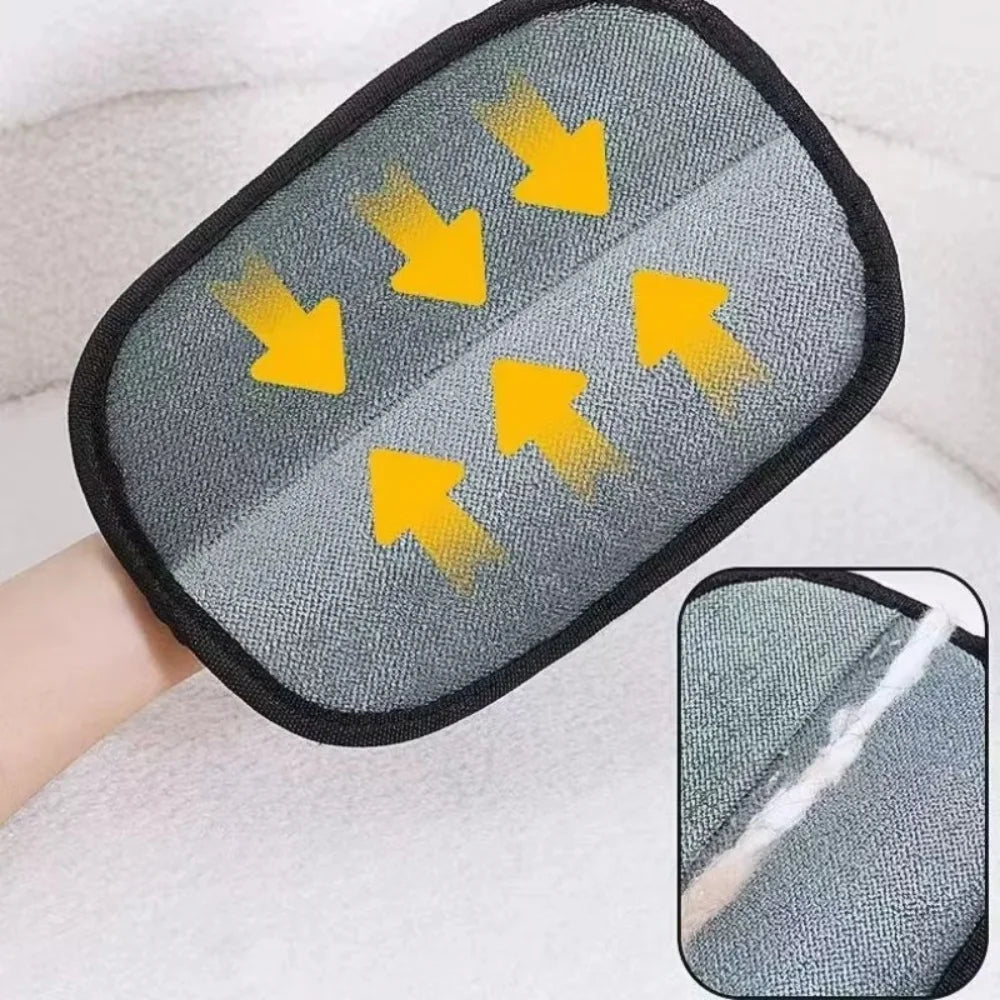 Grey textured cleaning mitt with black trim and yellow directional arrows showing hair removal.