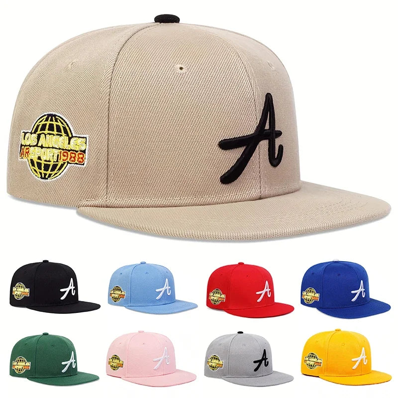 Unisex baseball cap in various colours, featuring a gothic letter ‘A’ on the front and a globe logo on the side.