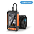 Black and orange industrial inspection camera with a handheld monitor displaying an engine and a coiled cable.