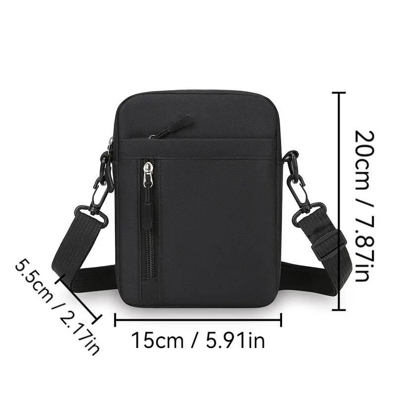 A compact black men’s crossbody bag with an adjustable shoulder strap and a zipped vertical front pocket.