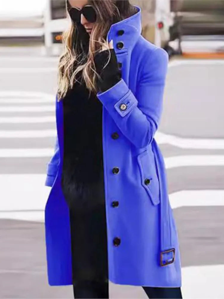 A vibrant blue wool-blend trench coat with a high collar, button-front, and belted cuffs.