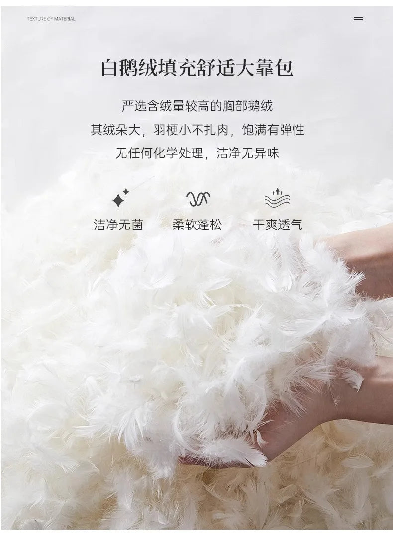 Close-up of fluffy white goose down feathers, demonstrating the high-quality, breathable filling for a bed frame.