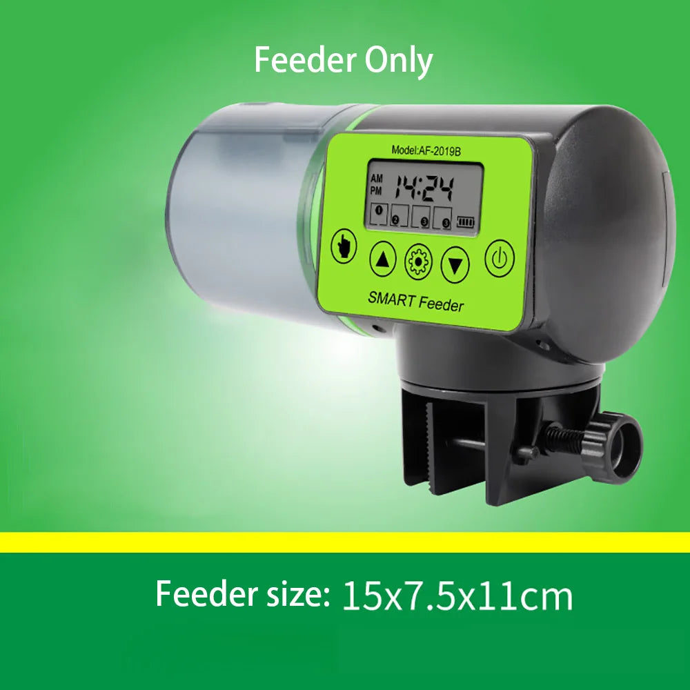 Black and green automatic fish food dispenser with a digital display, buttons, and a translucent food container.