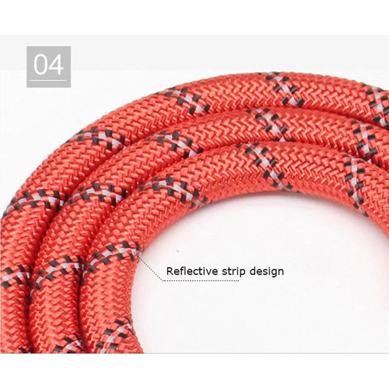 Close-up of a braided red, heavy-duty dog leash featuring integrated reflective strips for high visibility.