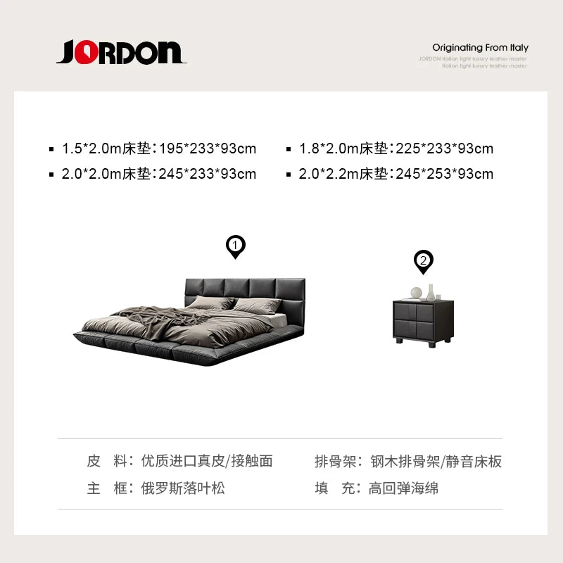 A modern, dark grey leather floating king size bed with a panelled headboard and a matching bedside table.