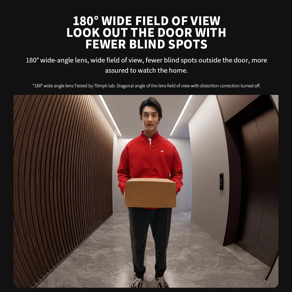 Wide-angle view of a delivery person holding a parcel, captured by a smart video doorbell with 180-degree visibility.