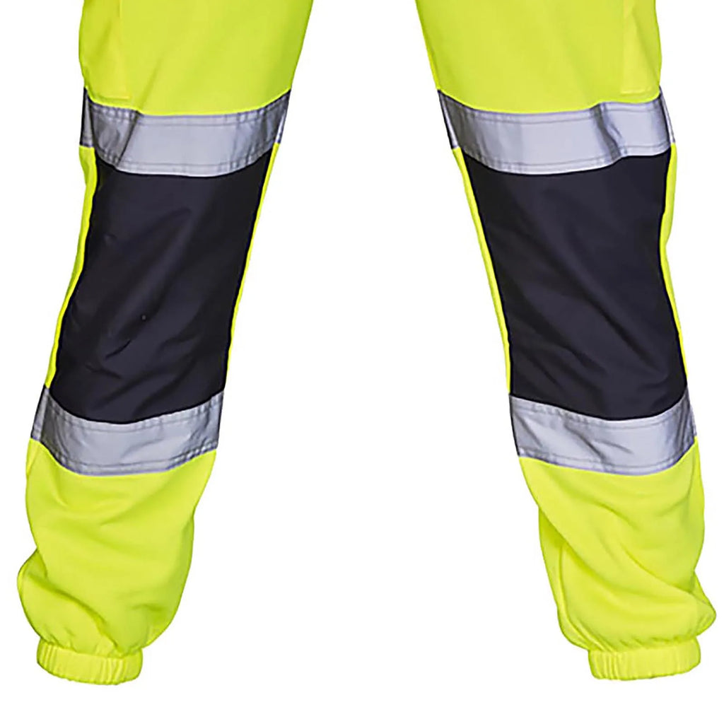High-vis yellow work trousers with black knee panels, reflective strips, and elasticated cuffs.