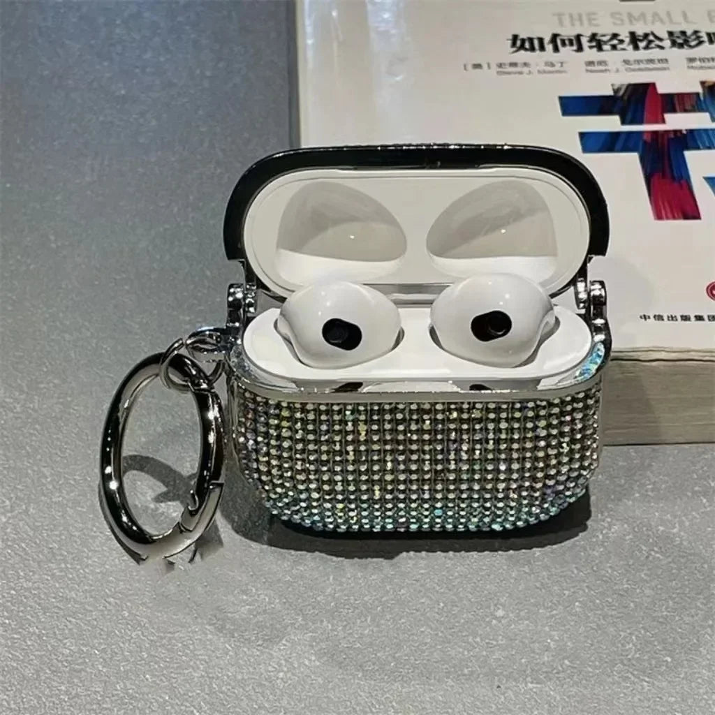 Silver crystal-embellished AirPods 3 case with a metal keychain ring.
