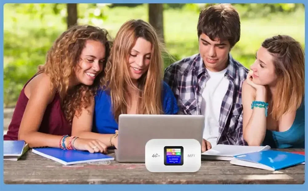 Small, white, portable 4G LTE Wi-Fi hotspot router with a digital screen, sitting on a table with students.