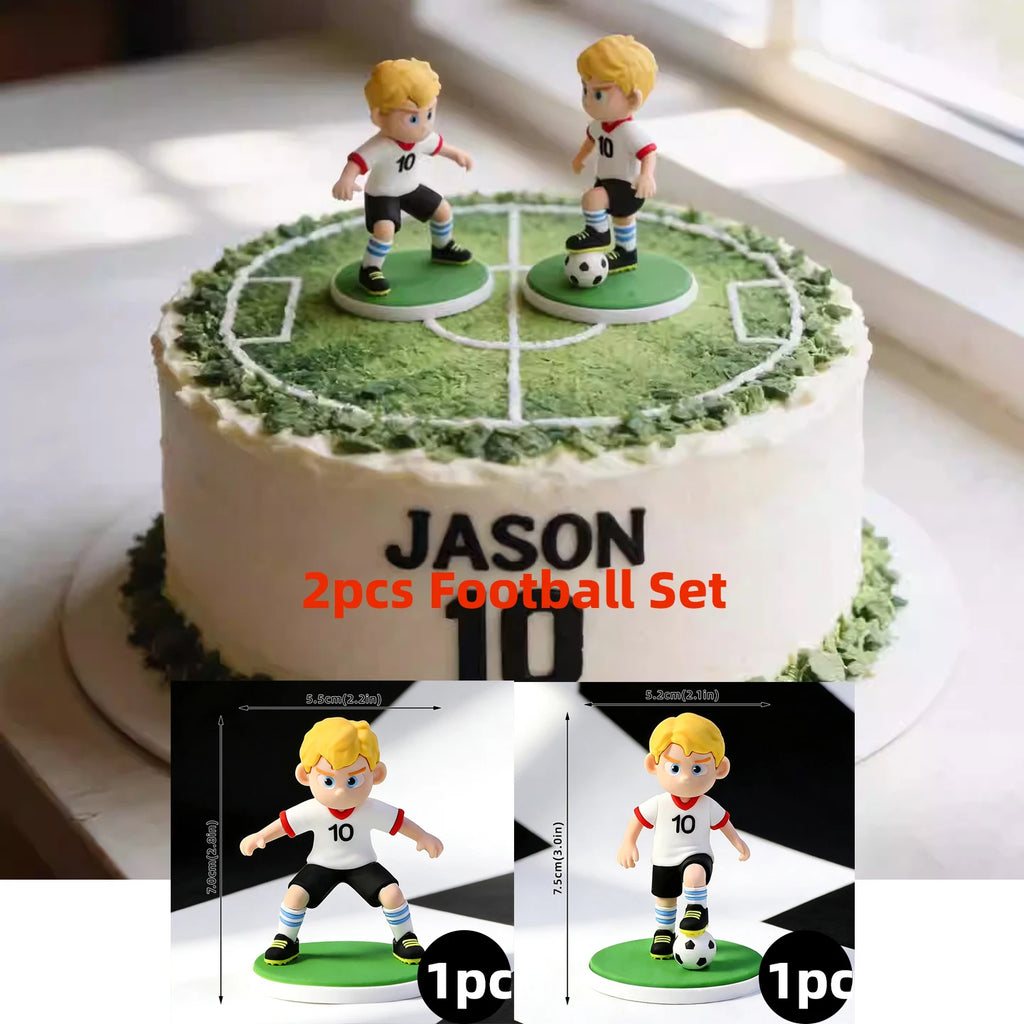 Set of 2 blonde footballer cake toppers in white kits, standing on green pitch bases. Perfect for sports-themed cakes.