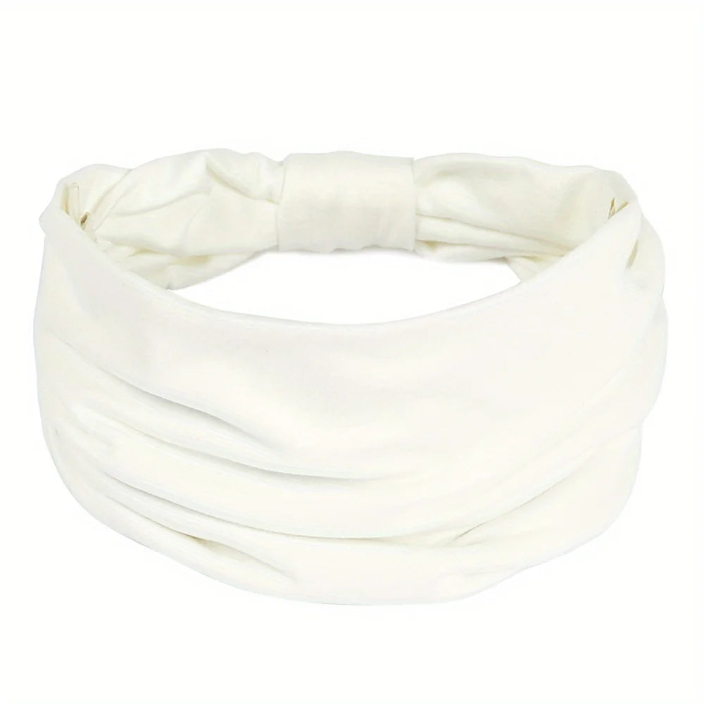 White fabric headband with a wide, gathered design and a knotted detail at the back.