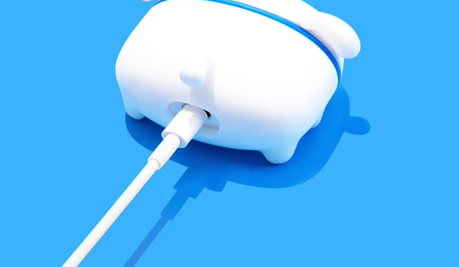 White silicone character AirPod case with blue trim, shown charging on a bright blue background.