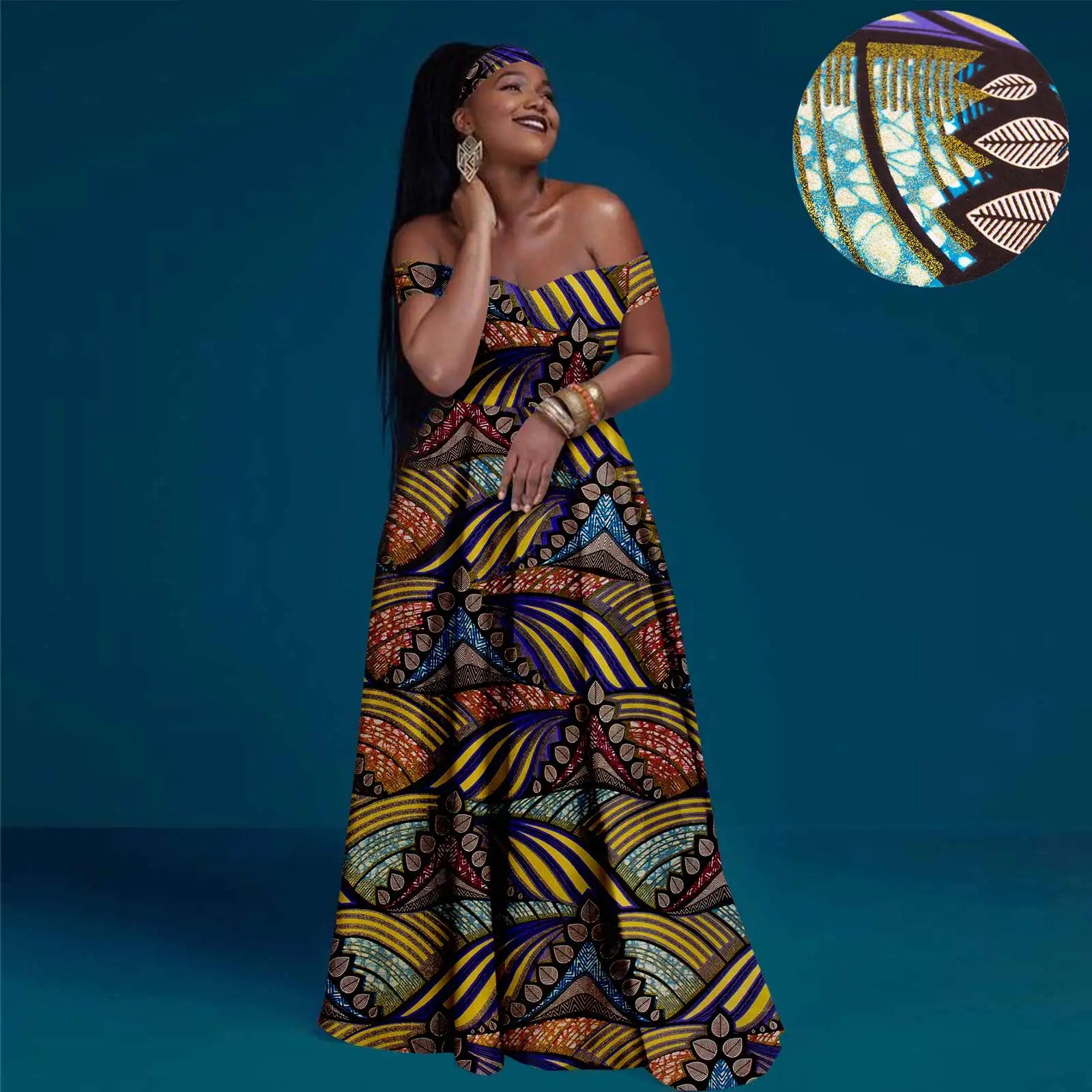 Model in an off-shoulder, floor-length maxi dress with a vibrant yellow, blue, and brown geometric tribal print.