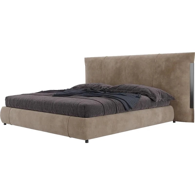 A contemporary taupe upholstered bed with a tall, panelled headboard and dark grey bedding.