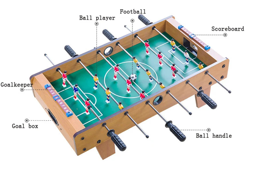 Tabletop foosball game with wooden-finish frame, green pitch, sliding scoreboards, and ergonomic black handles.