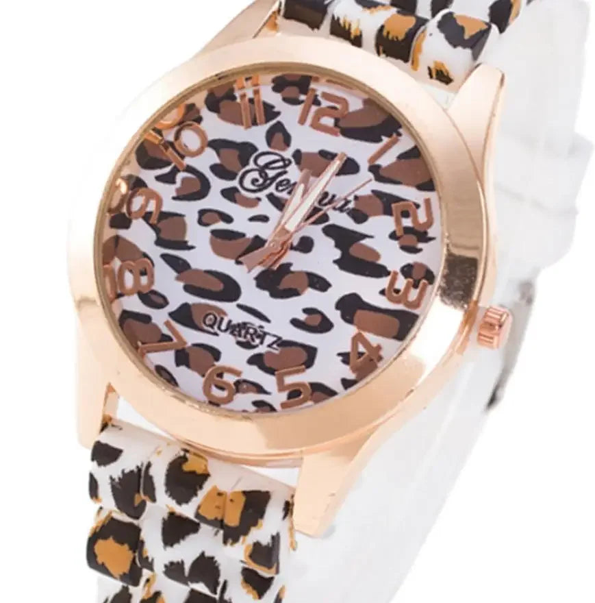 Women’s quartz watch with a gold-tone case and a white and brown leopard print silicone strap and dial.