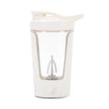 Off-white electric portable blender bottle with a clear body and integrated mixing whisk, isolated on white background.