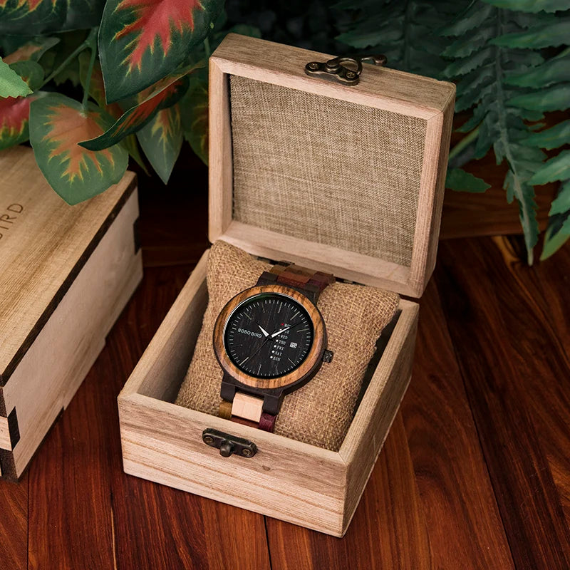 BOBO BIRD wooden watch with round black dial and date display in an open burlap-lined gift box.