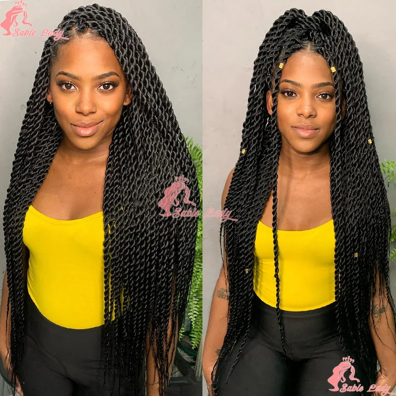 Black Senegalese twist braid wig with long synthetic strands and decorative gold hair cuffs.
