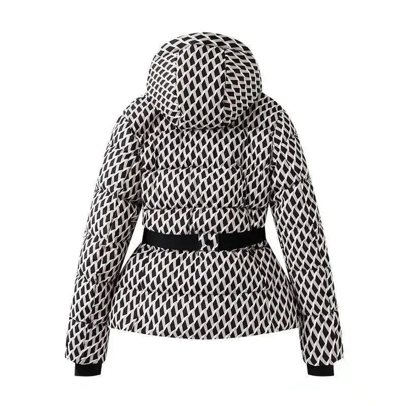 Back view of a black and white diamond-patterned quilted puffer jacket with a hood and a black waist belt.