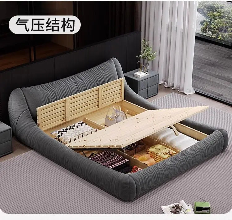 Modern grey upholstered bed frame with a gas-lift wooden slatted base revealing spacious under-bed storage.