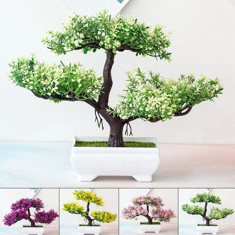 Small artificial bonsai tree with light green leaves and brown trunk in a white rectangular pot on a white surface.