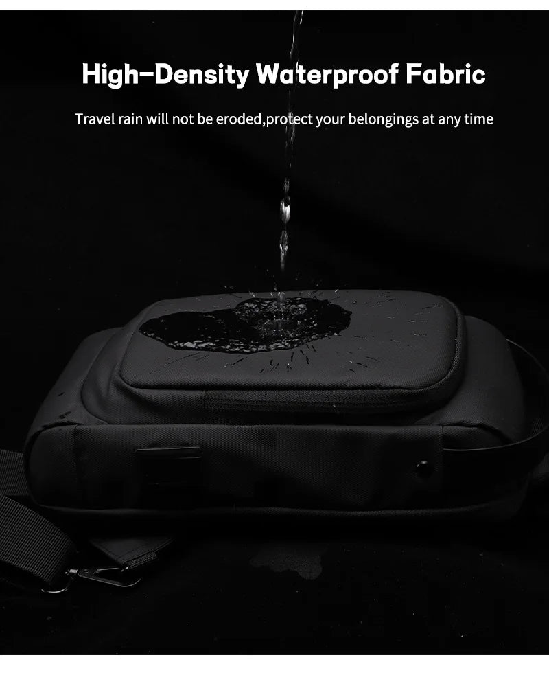 Black waterproof sling bag with water beading on the fabric surface. Includes an integrated USB charging port.