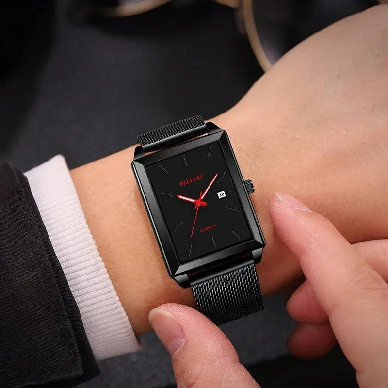 Men’s black rectangular quartz watch with a mesh stainless steel strap, red hands, and a date display.