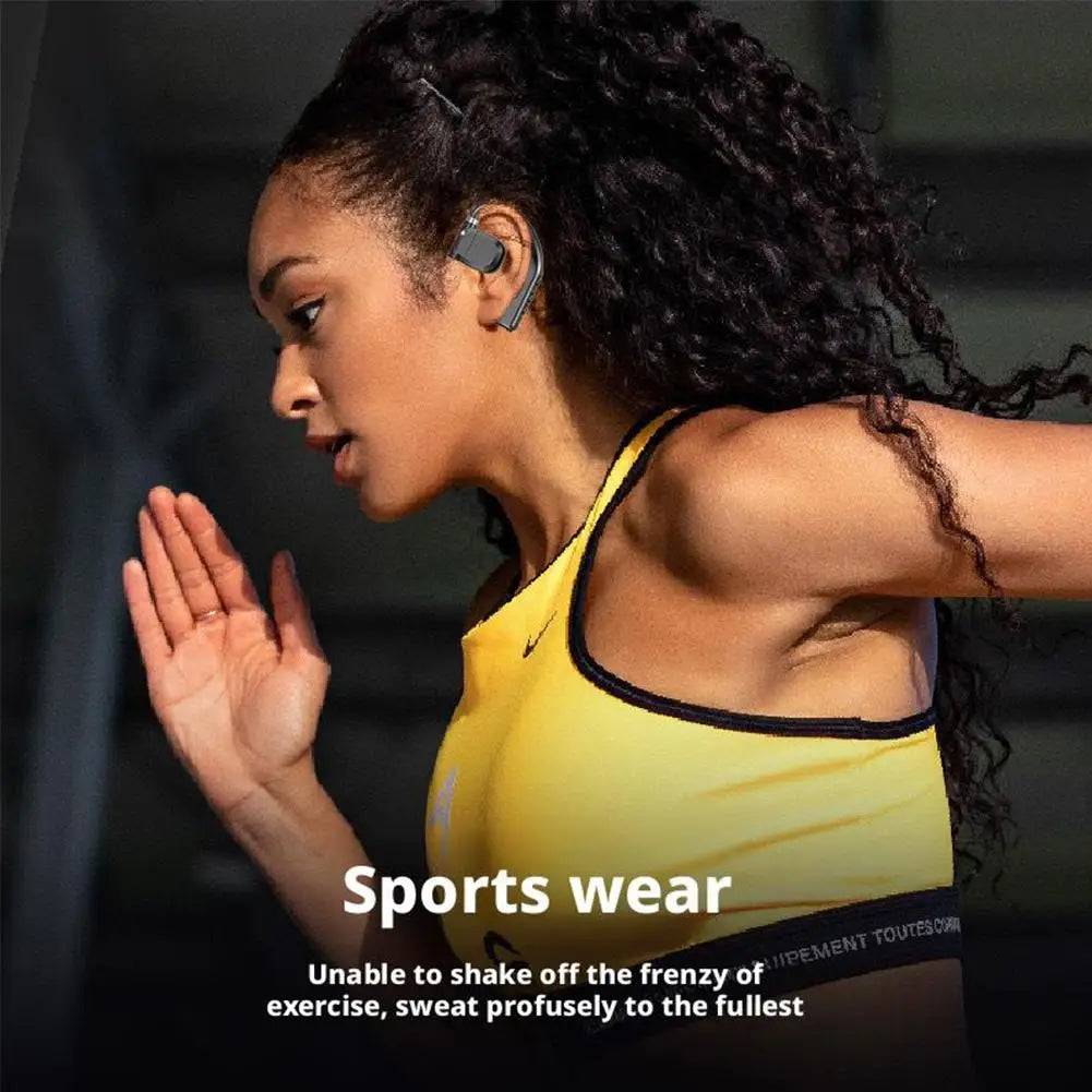 Runner wearing grey, sleek, hook-style wireless earbuds during a workout.