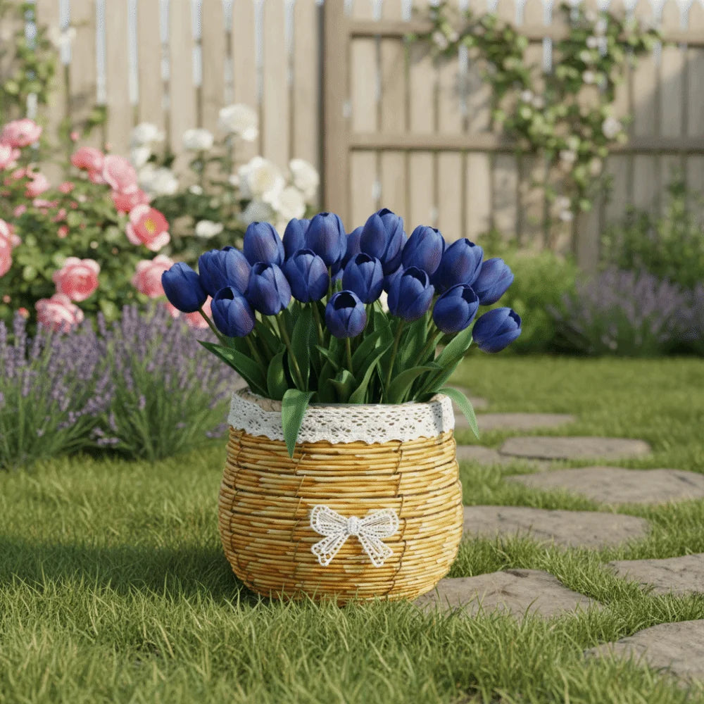 A rustic woven basket with a white lace trim and bow, filled with deep blue tulips in a sunlit garden setting.